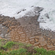 Rocks on the coast of Consolação caused by former volcanic activity